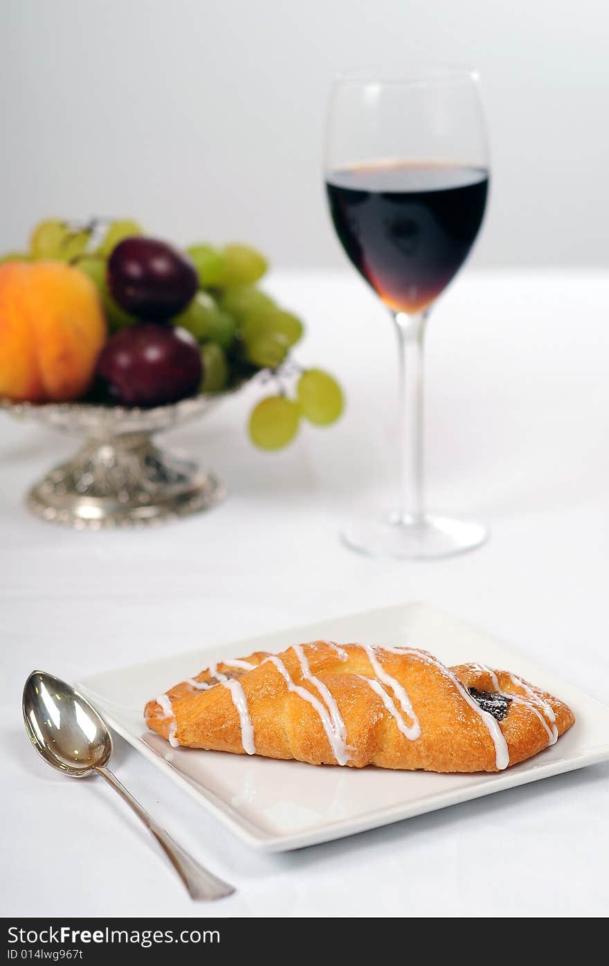 A view with a piece of cake over white background