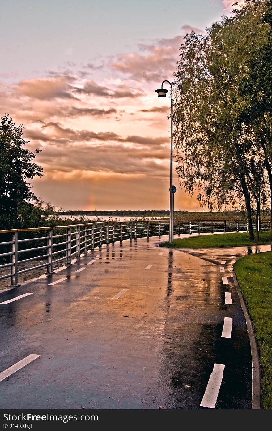 View on the pedestrian road which is is going near the sea, sunset time