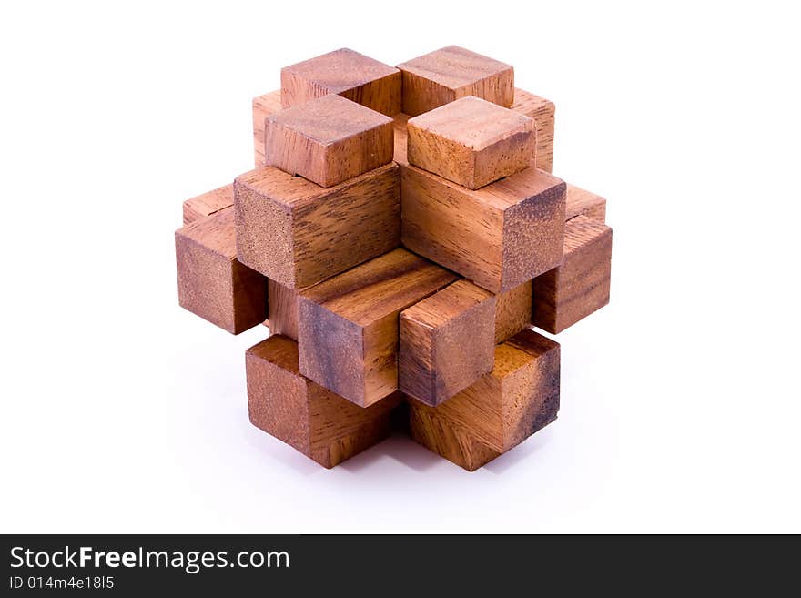 Assembled 24 piece burr puzzle in wood on white background