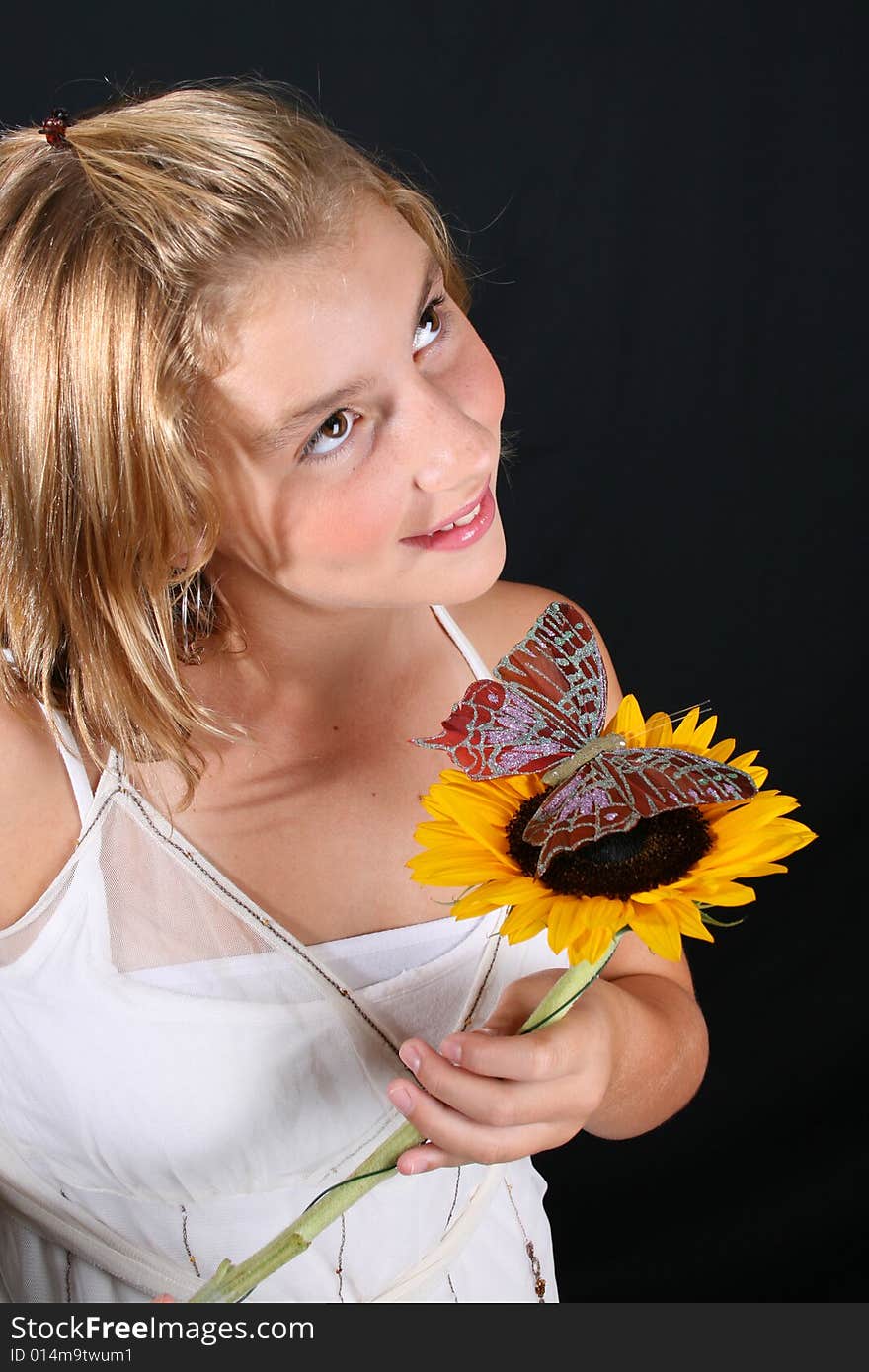 Teenage female model on a black background. Teenage female model on a black background