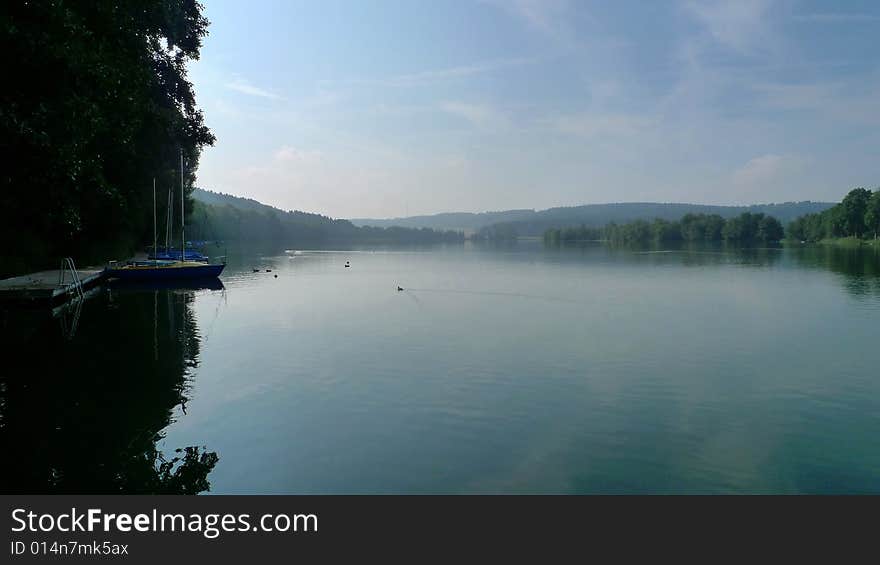 Lake Federsee on a misty morning just after dawn. Lake Federsee on a misty morning just after dawn