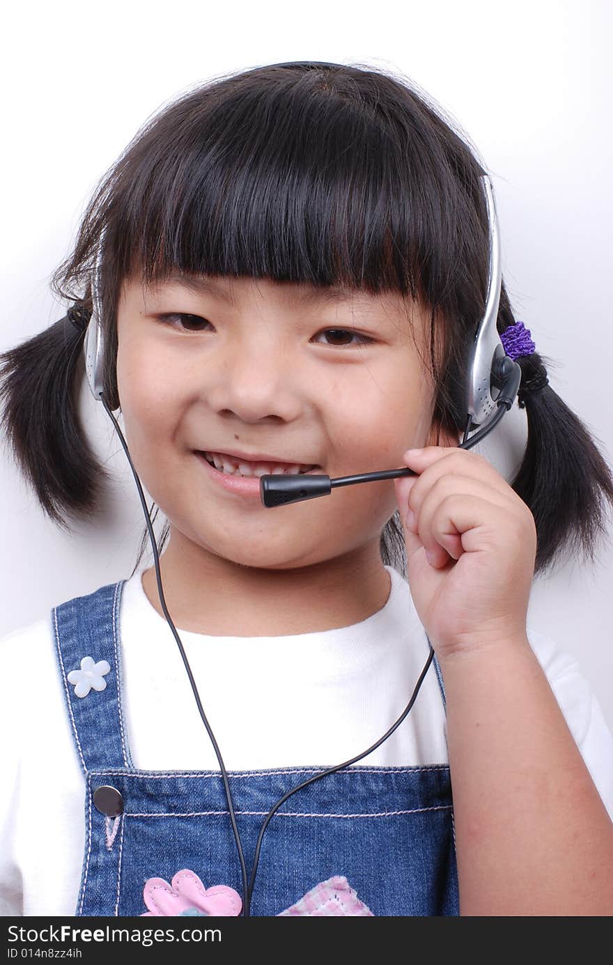 Asia girl making a phone call with headphone. Asia girl making a phone call with headphone