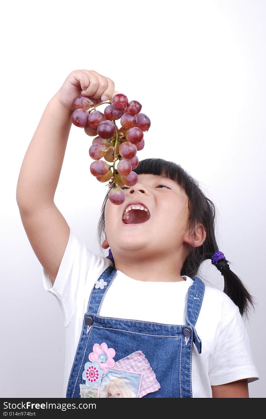 Girl eating grape