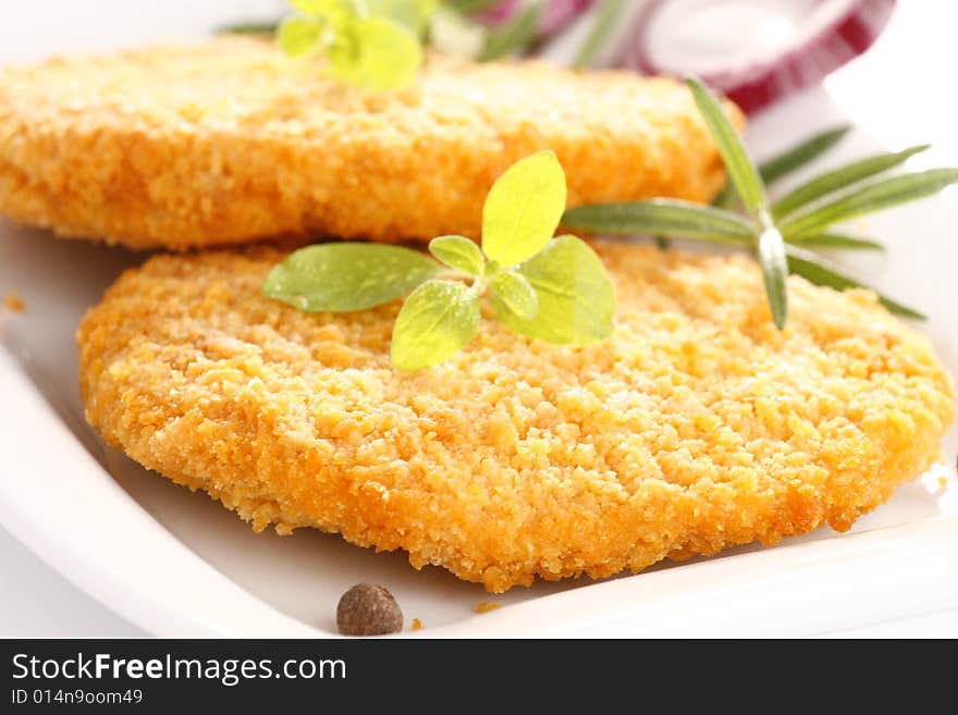 Fried chicken with herbs and onion. Fried chicken with herbs and onion