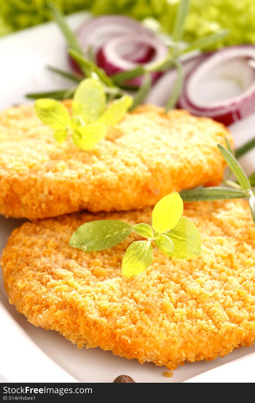 Fried chicken with herbs and onion. Fried chicken with herbs and onion