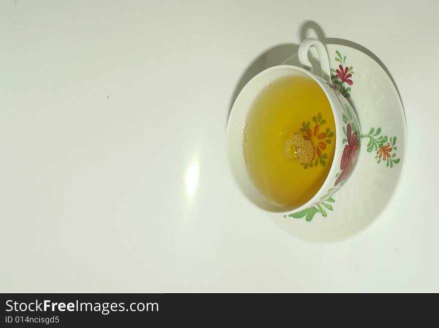 A close up view of a cup of green tea. A close up view of a cup of green tea