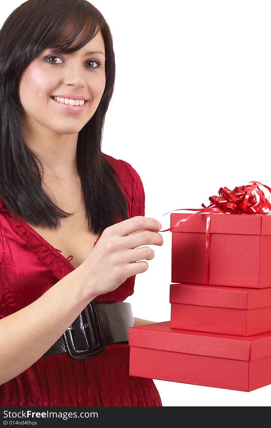 Portrait of a beautiful young brunette woman holding red gift boxes at a celebration. Portrait of a beautiful young brunette woman holding red gift boxes at a celebration