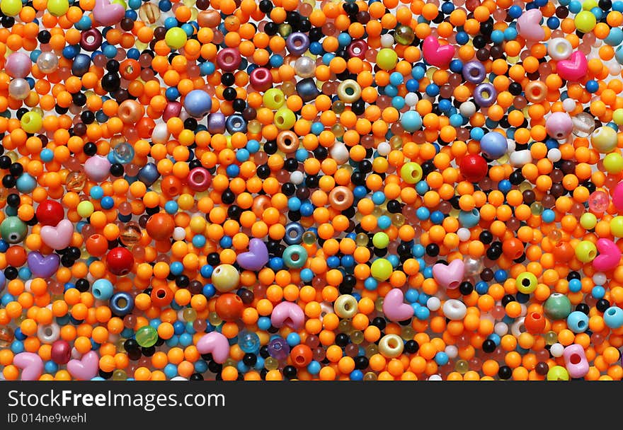 Multicolored small plastic beads background