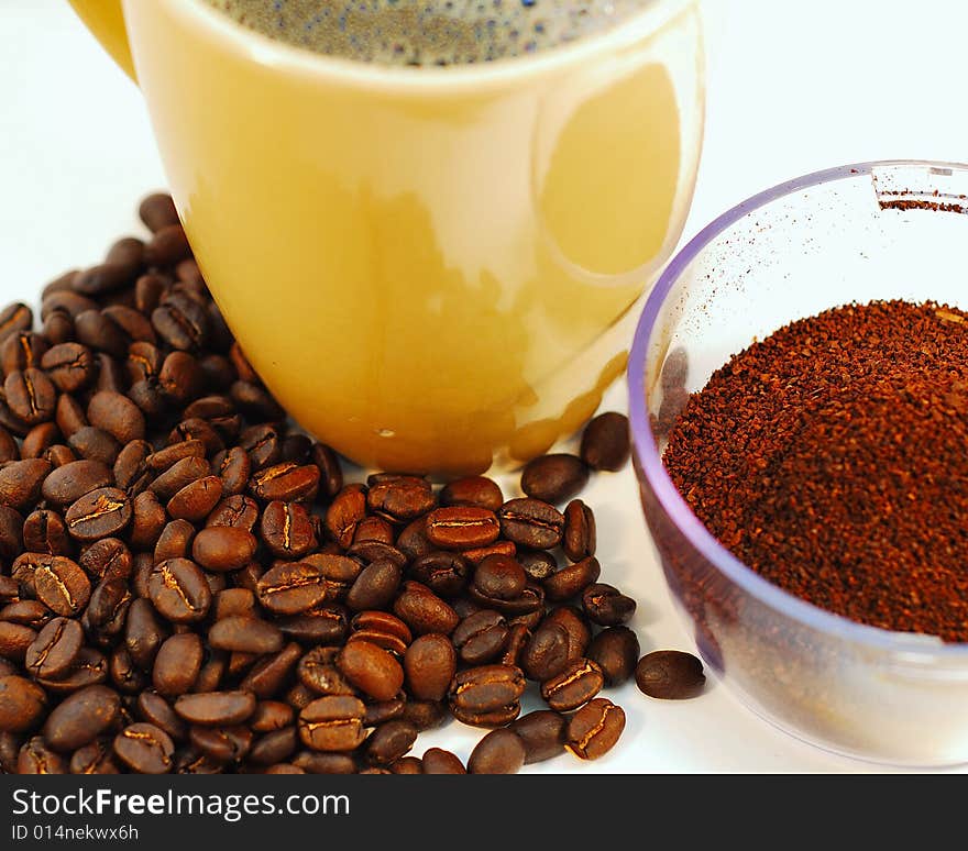 This is a shot of fresh ground coffee and some coffee beans.