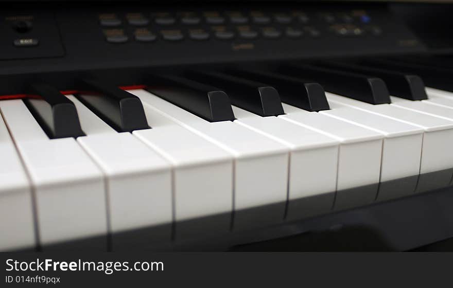 Digital piano keys close up