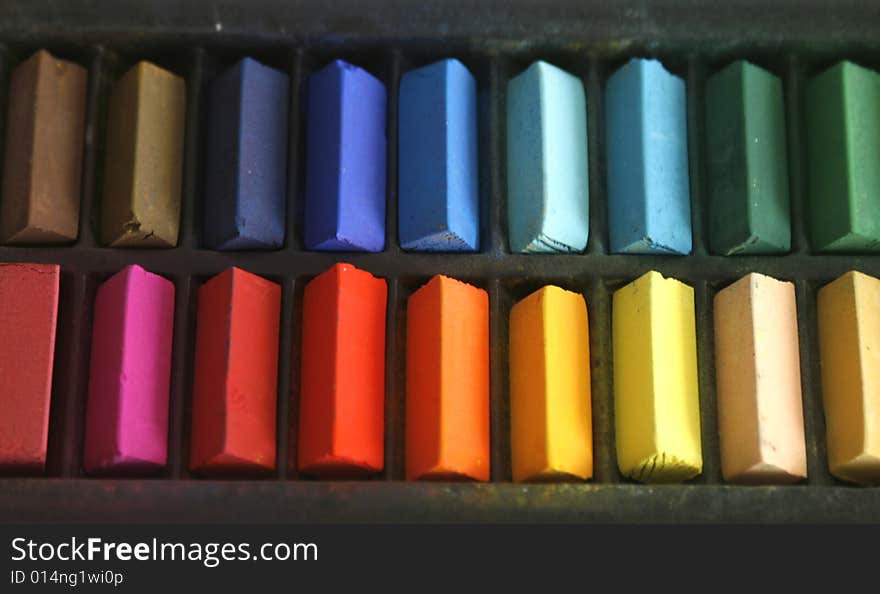 Close up of coloured pastels in a box. Close up of coloured pastels in a box