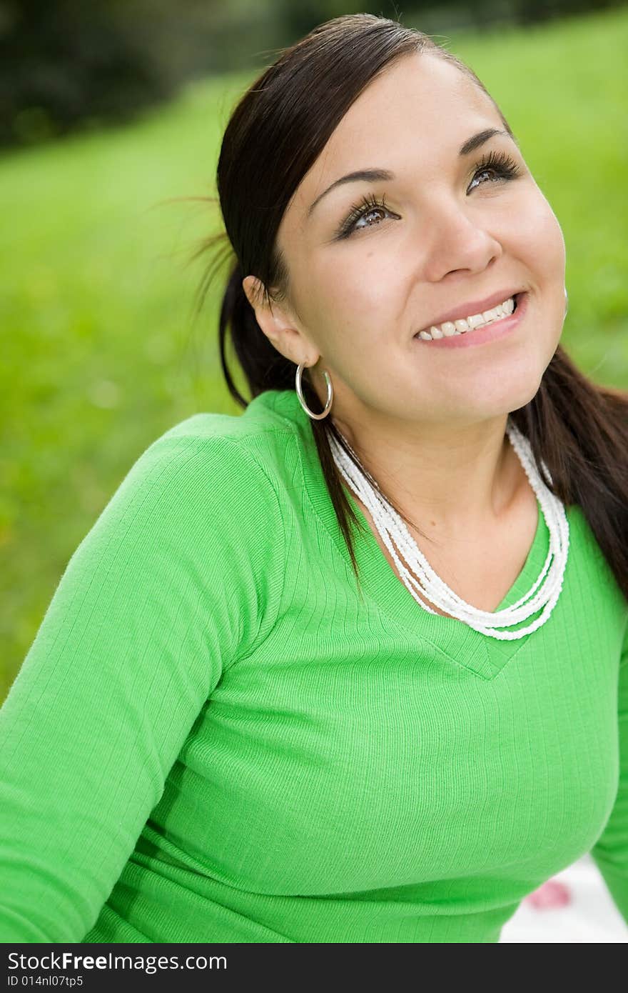 Attractive brunette woman in park. Attractive brunette woman in park