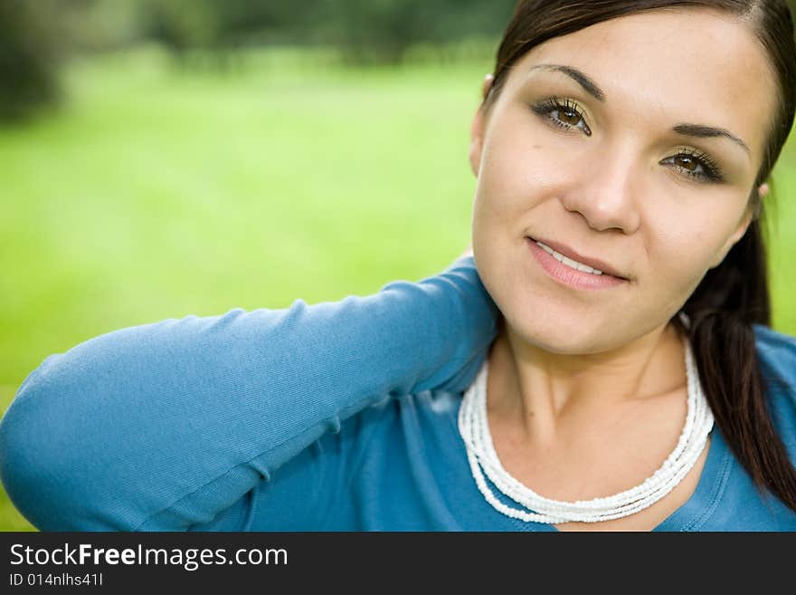 Attractive brunette woman in park. Attractive brunette woman in park