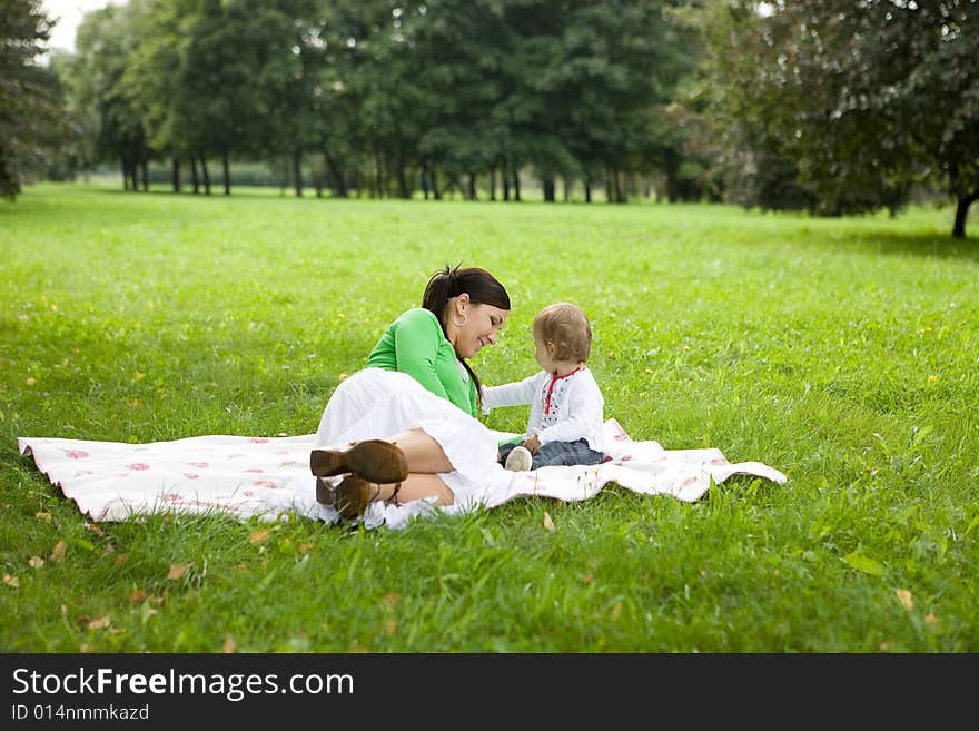 Happy family on green meadow. Happy family on green meadow