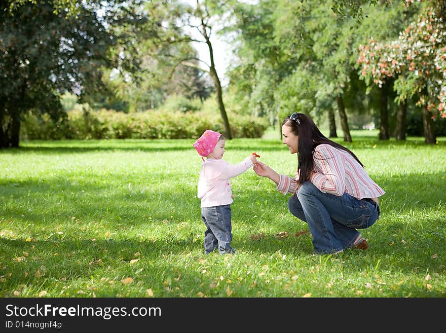 Happy family on green meadow. Happy family on green meadow