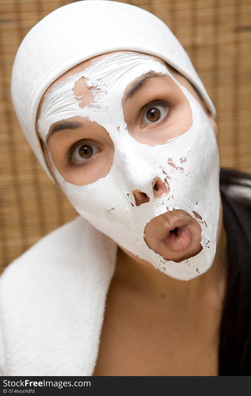 Attractive brunette woman with facial mask