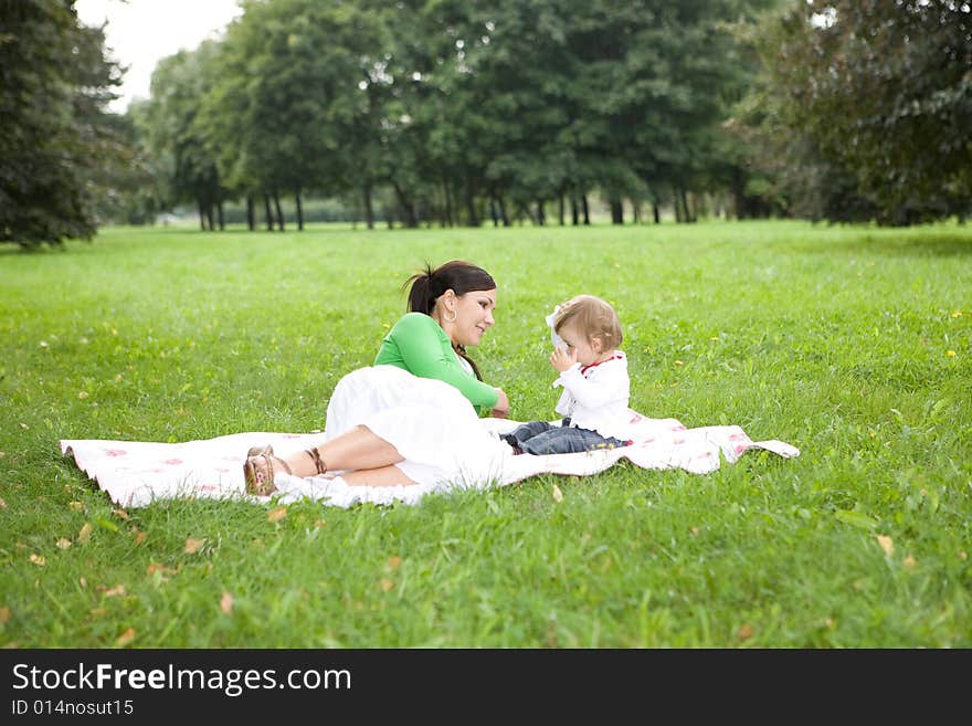 Happy family on green meadow. Happy family on green meadow