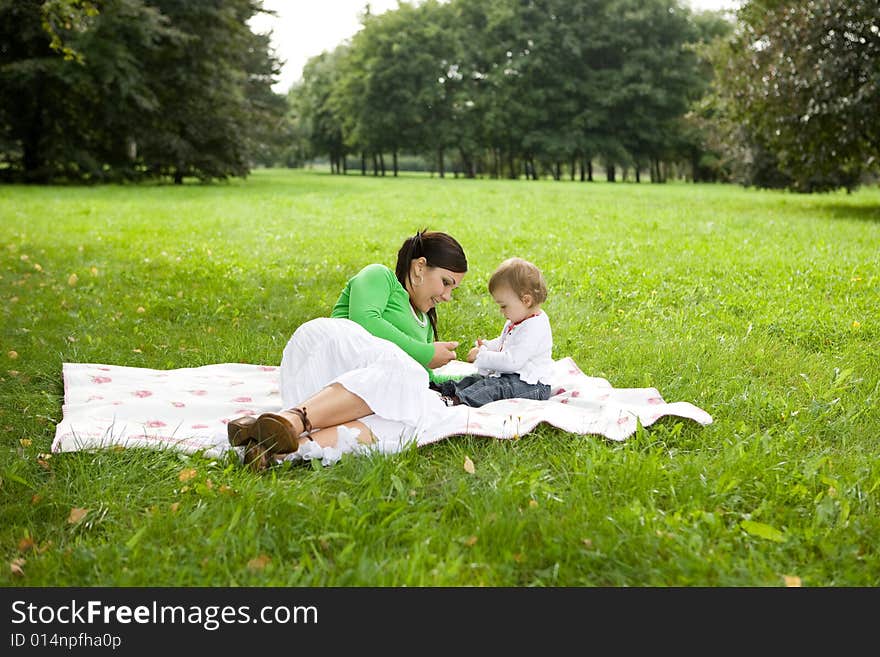 Happy family on green meadow. Happy family on green meadow