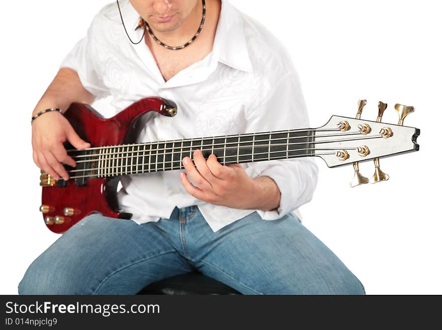 Young man play on guitar on white