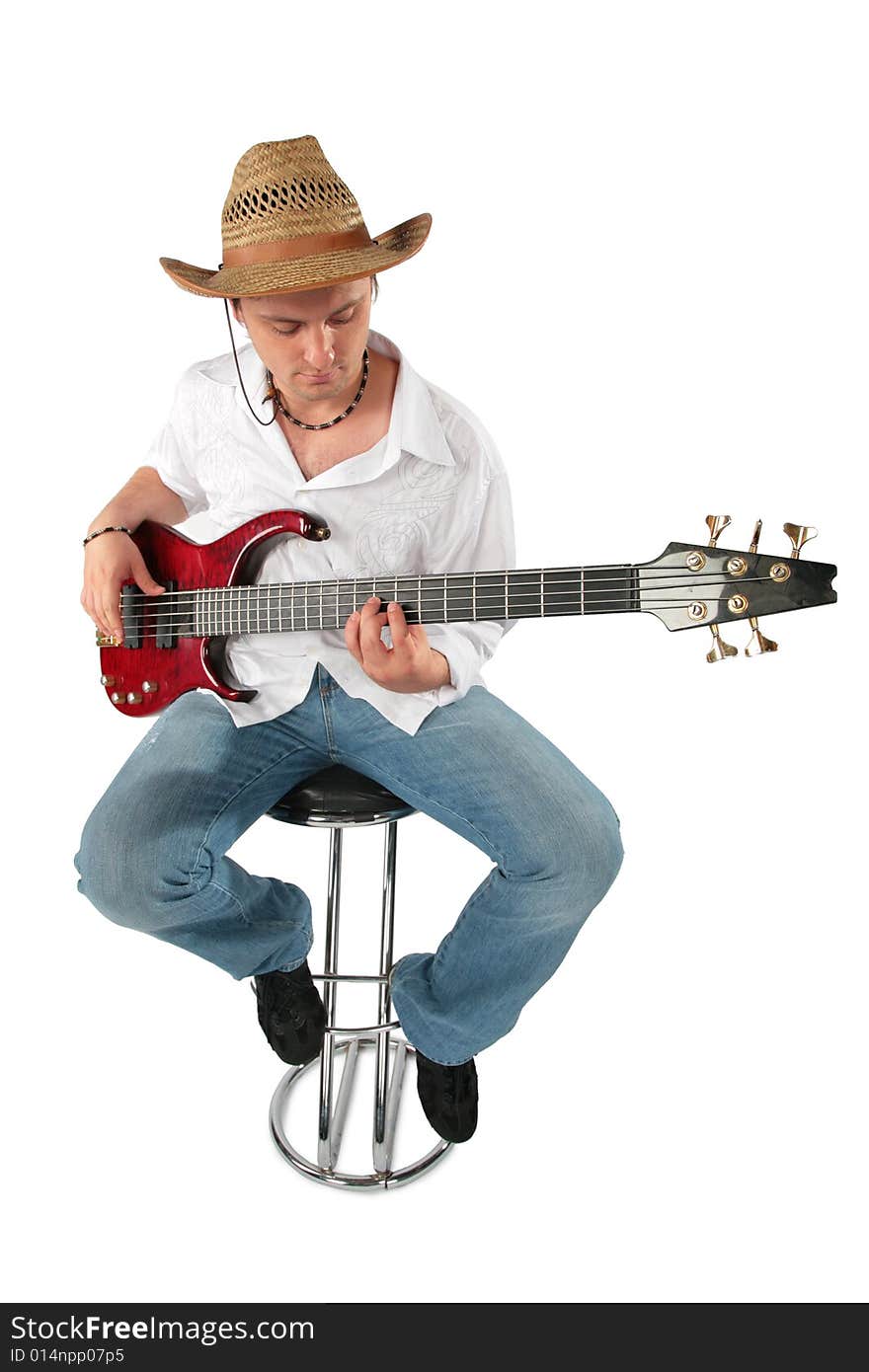 Young guitarist in hat. Full body. On white