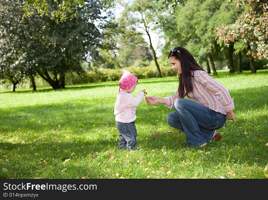 Happy family on green meadow. Happy family on green meadow