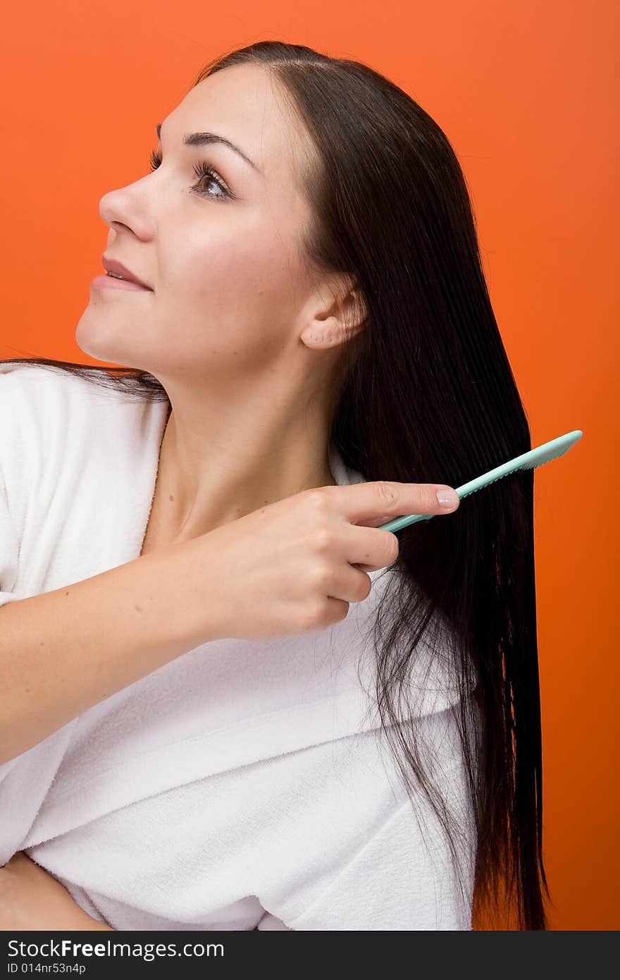 Attractive and fresh brunette woman on orange background. Attractive and fresh brunette woman on orange background