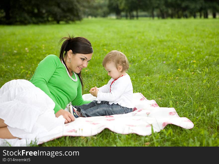 Happy family on green meadow. Happy family on green meadow