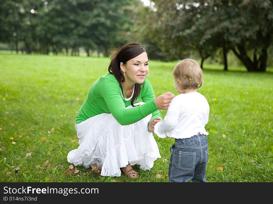 Happy family on green meadow. Happy family on green meadow