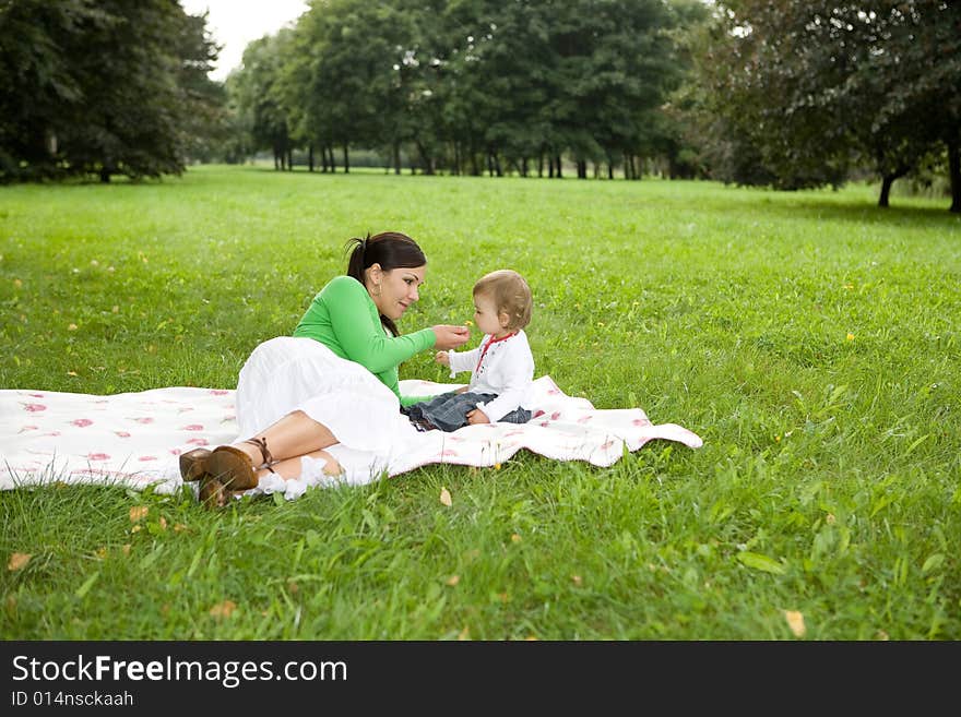 Happy family on green meadow. Happy family on green meadow