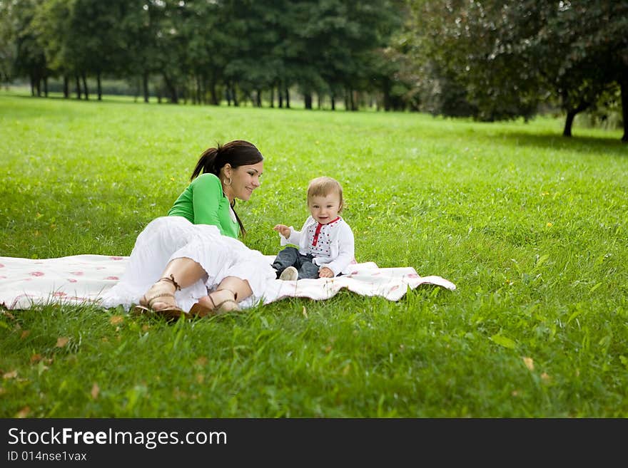 Happy family on green meadow. Happy family on green meadow