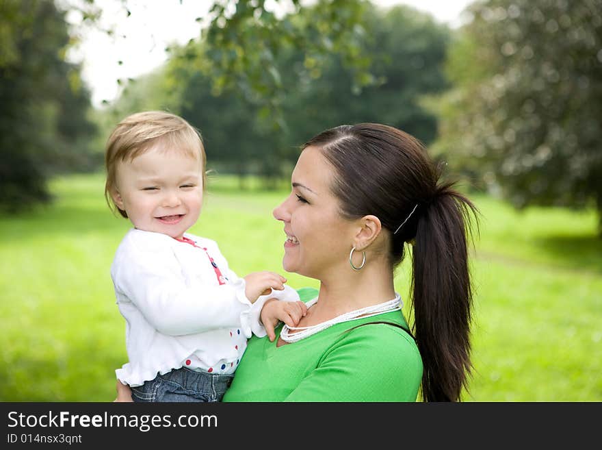 Happy family on green meadow. Happy family on green meadow