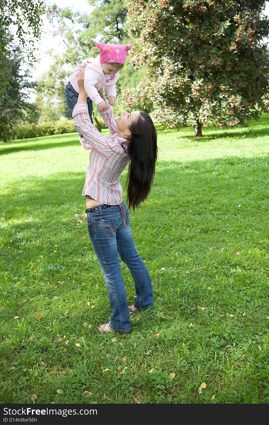 Happy family on green meadow. Happy family on green meadow