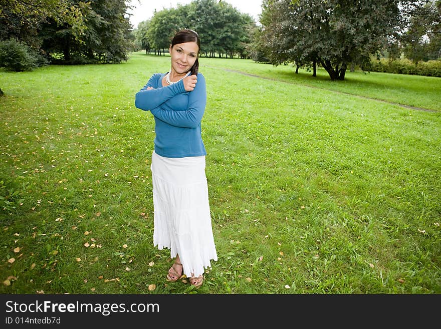 Attractive brunette woman in park. Attractive brunette woman in park