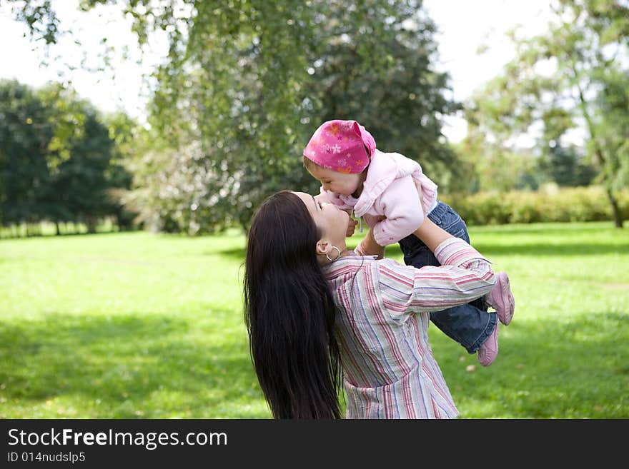 Happy family on green meadow. Happy family on green meadow