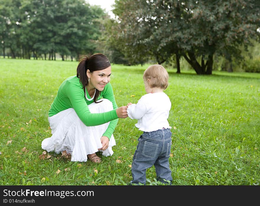 Happy family on green meadow. Happy family on green meadow