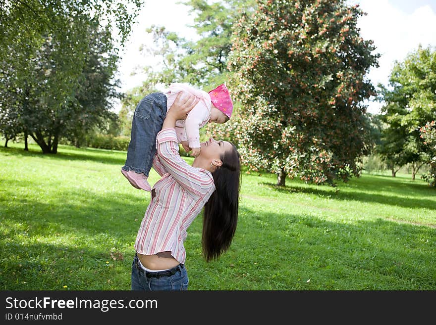 Happy family on green meadow. Happy family on green meadow