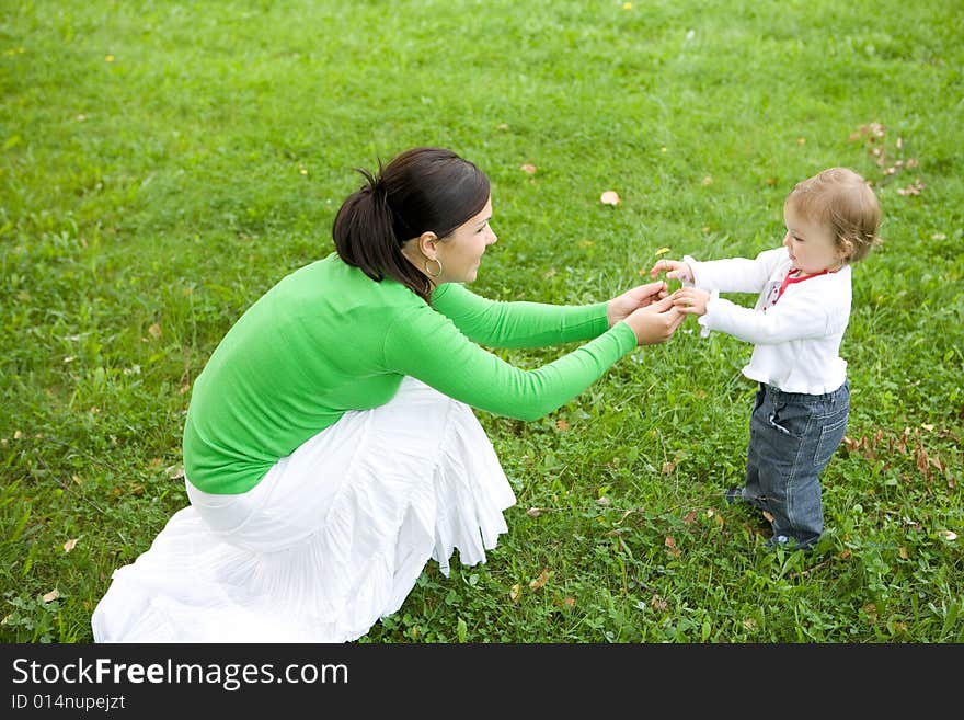 Happy family on green meadow. Happy family on green meadow