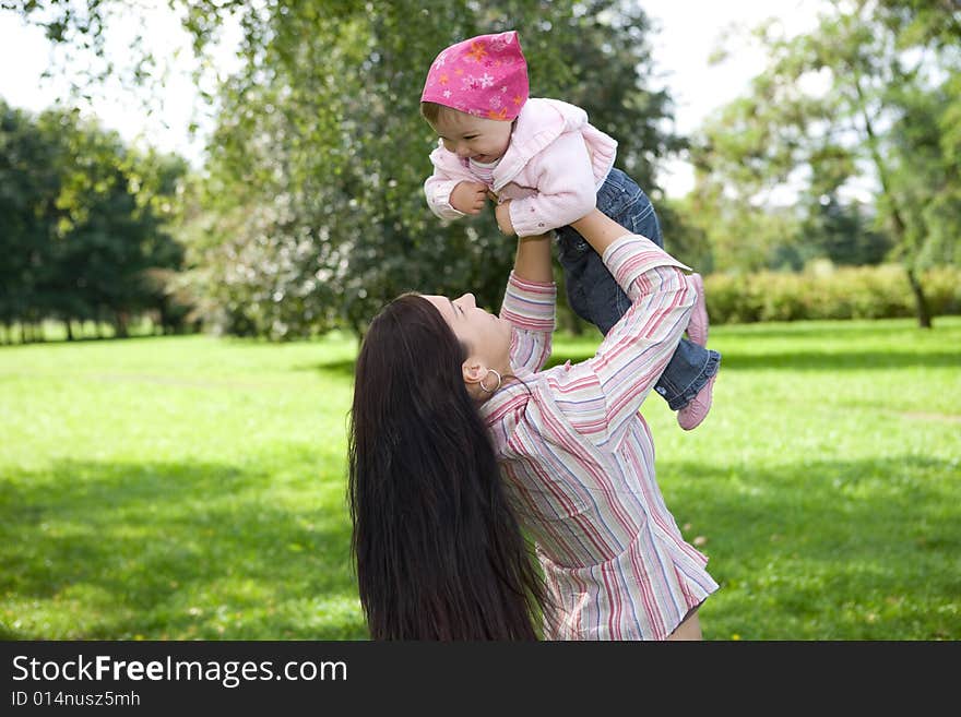 Happy family on green meadow. Happy family on green meadow