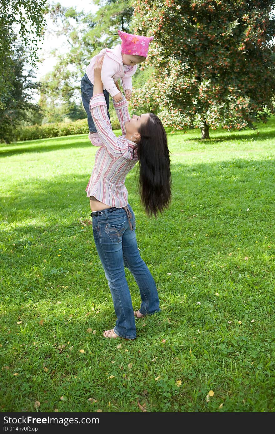 Happy family on green meadow. Happy family on green meadow