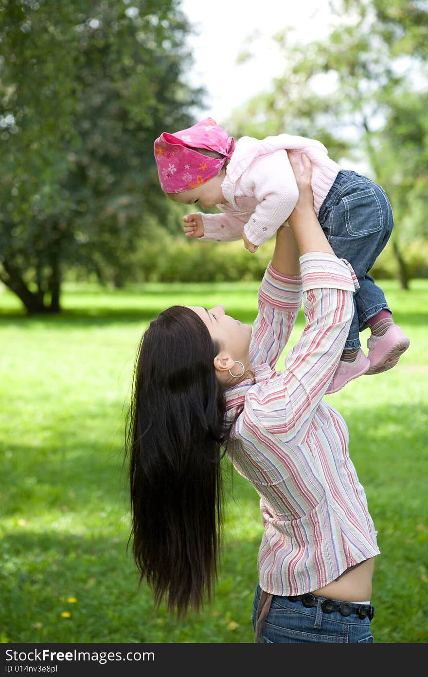 Happy family on green meadow. Happy family on green meadow