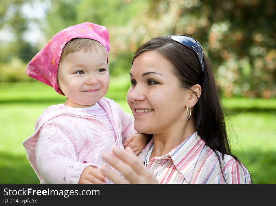 Happy family on green meadow. Happy family on green meadow