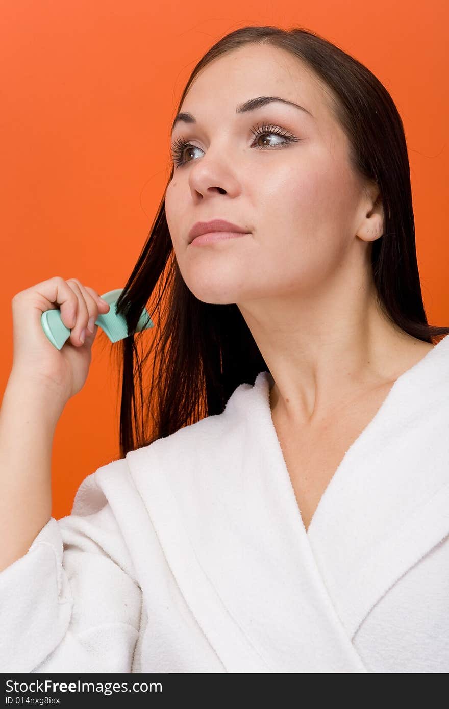 Attractive and fresh brunette woman on orange background. Attractive and fresh brunette woman on orange background