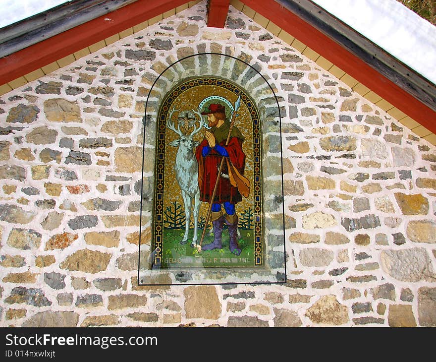 A beautiful shot of an icon with a Saint in a little mountain's church