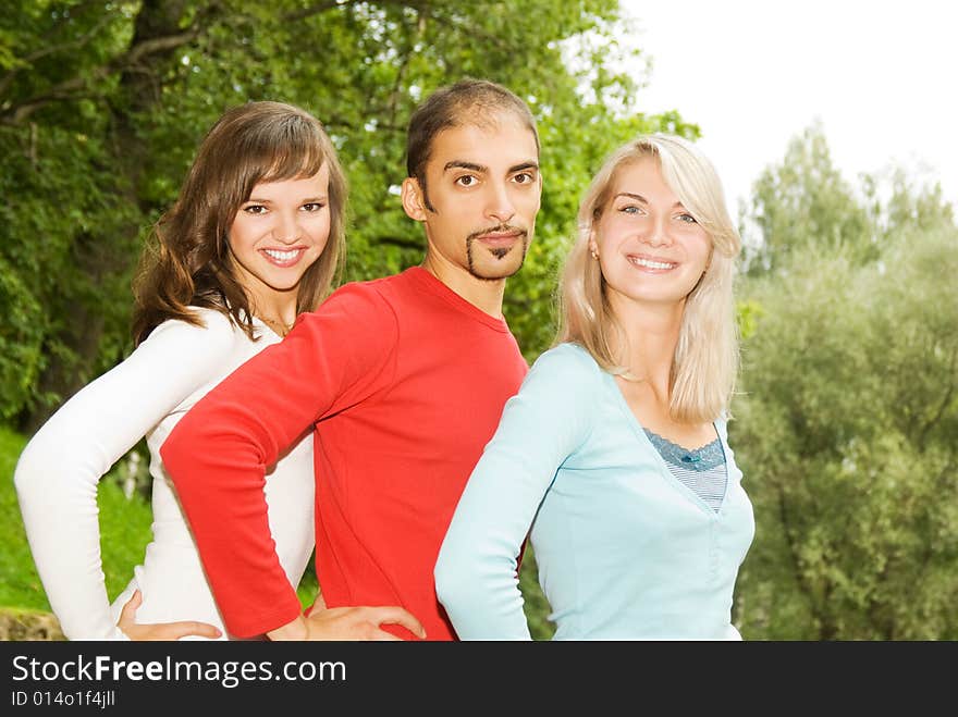 Group of young people put hands on top of each other