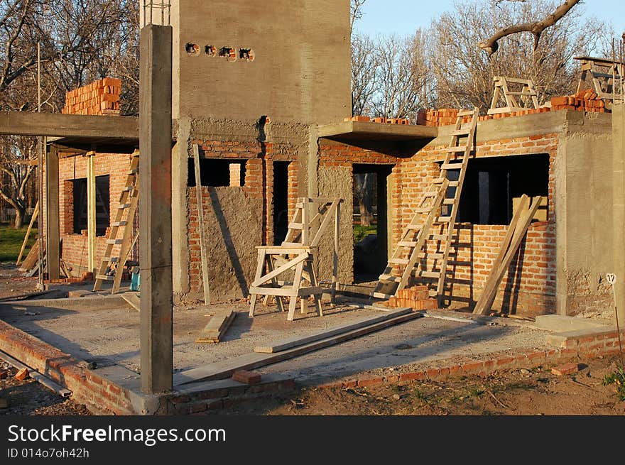 Construction o a brick house in a private neighborhood. Construction o a brick house in a private neighborhood