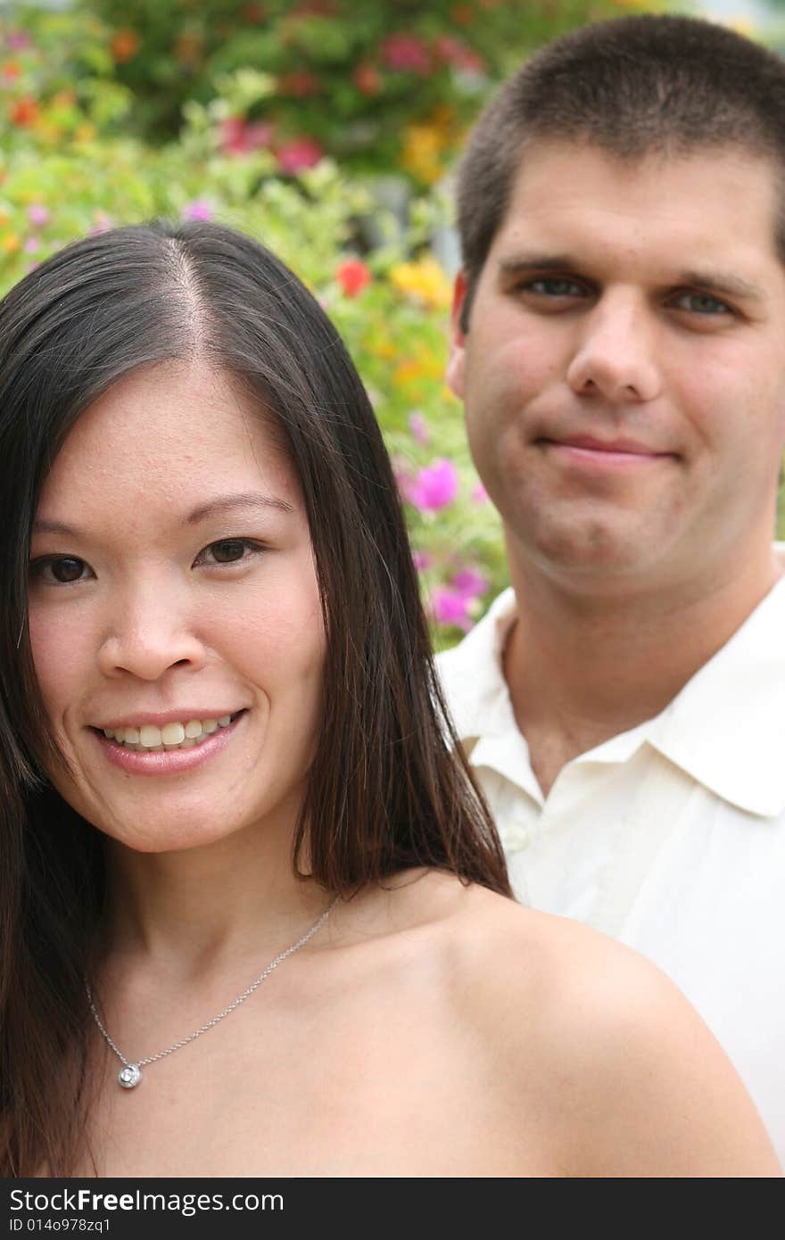 Attractive bride and groom on their wedding day. Attractive bride and groom on their wedding day.