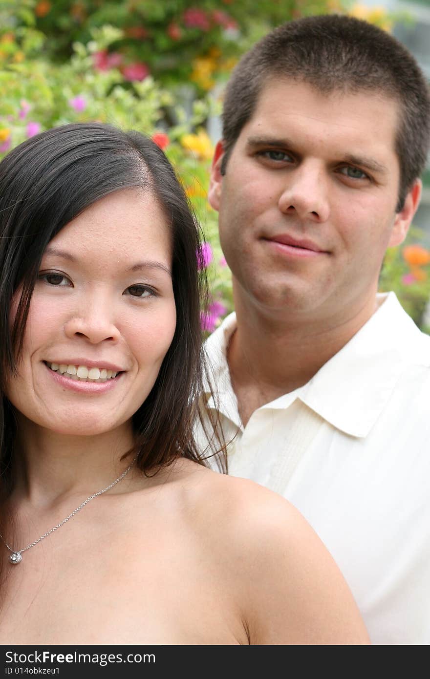 Attractive bride and groom on their wedding day. Attractive bride and groom on their wedding day.