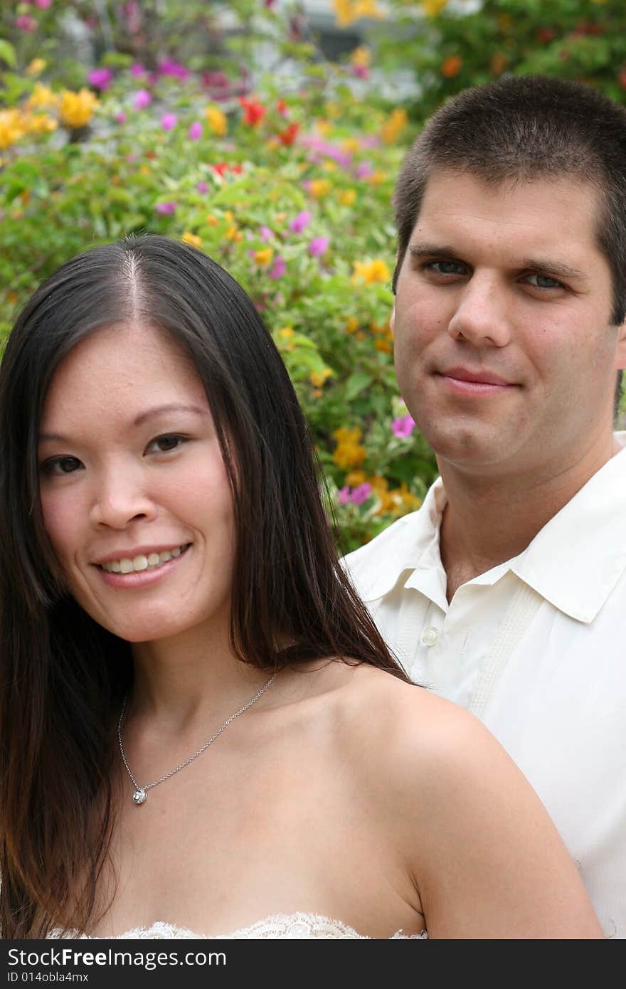 Attractive bride and groom on their wedding day. Attractive bride and groom on their wedding day.