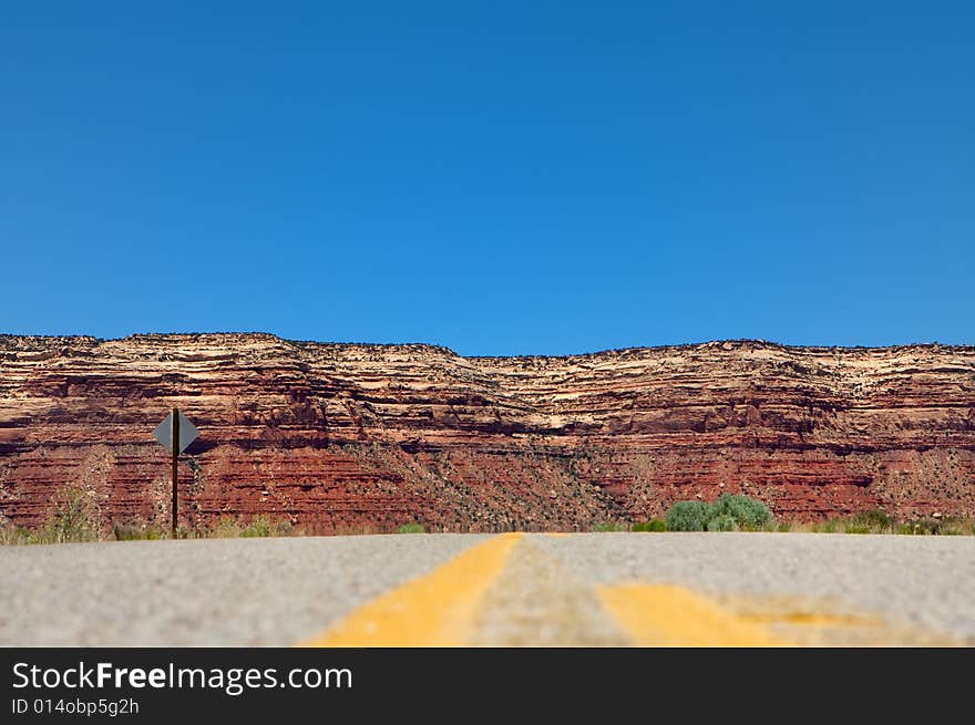 Desert highway leading into mountains