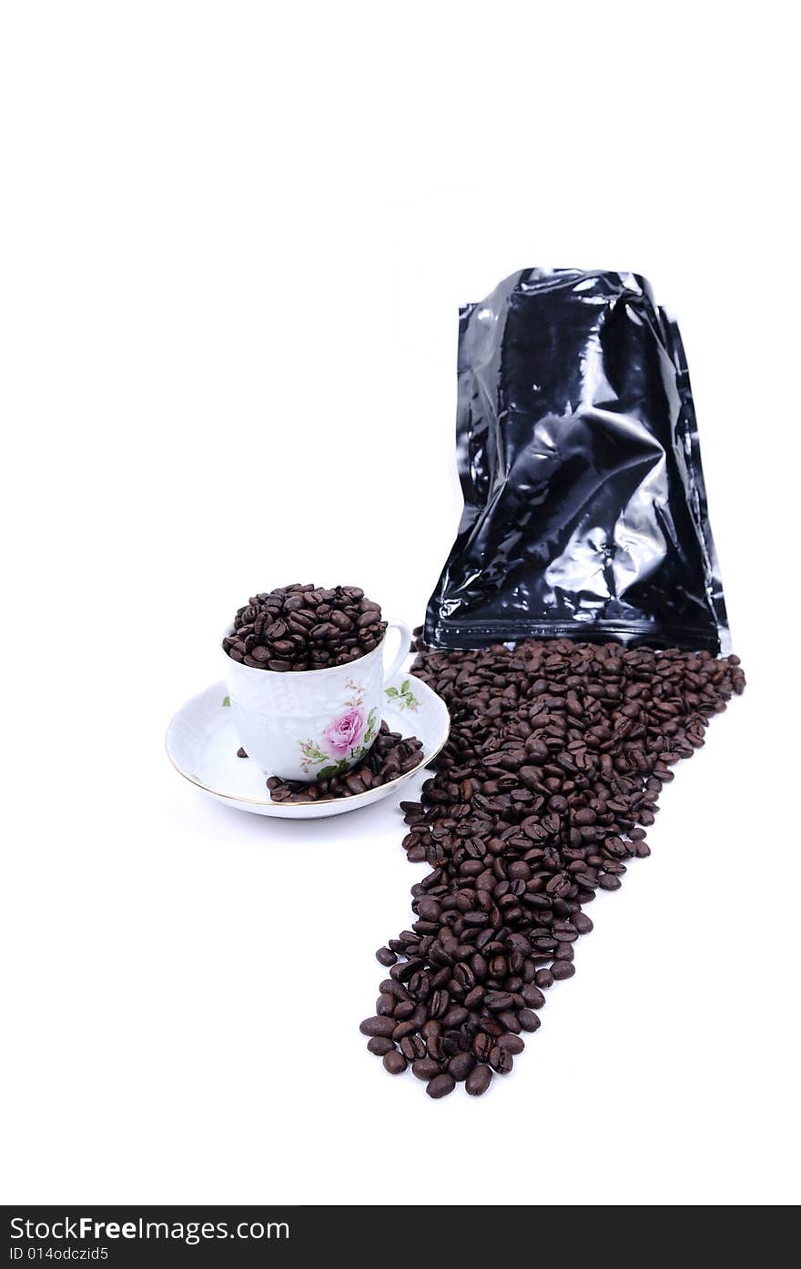 Coffee beans spilled from bag on white background. Coffee beans spilled from bag on white background